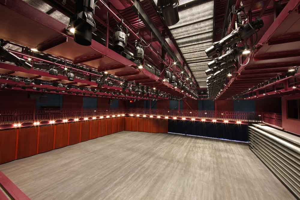 Hylton Performing Arts Center 200-seat Gregory Family Theater with orchestra rehearsal lighting on.